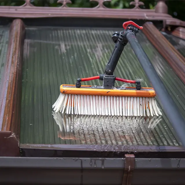 A close-up of a water-fed brush being used by Crystal Clean Windows to clean a conservatory roof in Parson Drove and Wisbech.