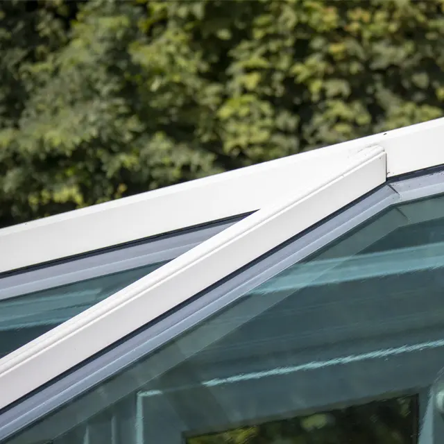 Close-up of a sparkling clean glass conservatory roof and white frame after professional cleaning in Wisbech.