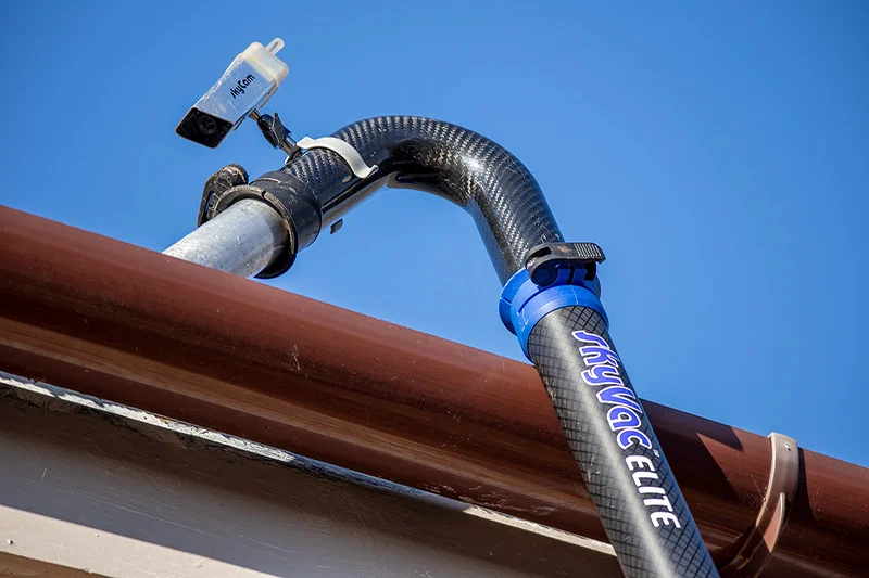 Crystal Clean Windows using a SkyVac Elite gutter vacuum with a SkyCam to safely clean residential gutters from the ground in Parson Drove.